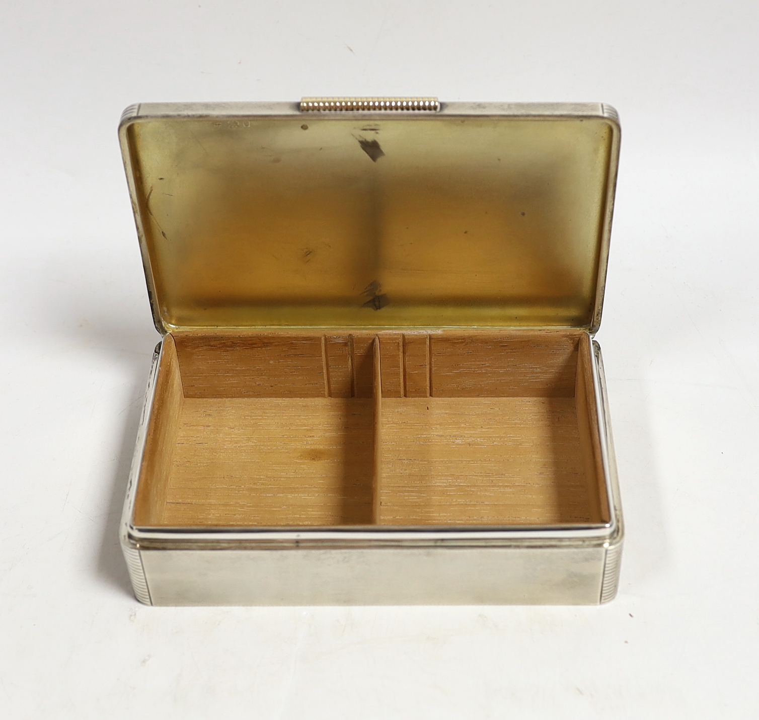 A George VI engine turned silver mounted rectangular cigarette box, Padgett & Braham Ltd, London, 16.5cm.